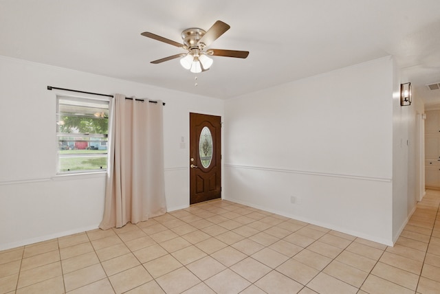 805 S Rusk St, Weatherford, TX 76086 - foyer entrance with ceiling fan, crown molding, light tile patterned floors, and baseboards