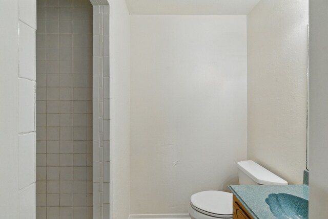 805 S Rusk St, Weatherford, TX 76086 - bathroom featuring toilet and vanity