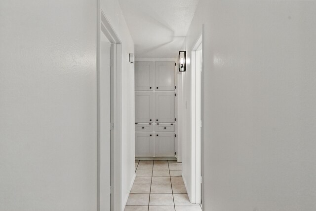 805 S Rusk St, Weatherford, TX 76086 - corridor featuring light tile patterned floors