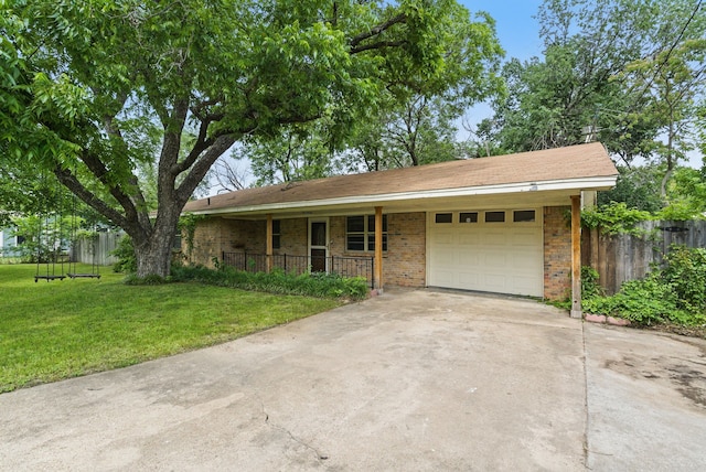 805 S Rusk St, Weatherford, TX 76086 - ranch-style house with a garage, covered porch, concrete driveway, and brick siding