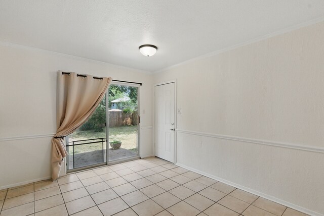 805 S Rusk St, Weatherford, TX 76086 - spare room featuring baseboards and ornamental molding