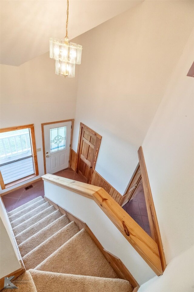 3017 County Road 154, Tuscola, TX 79562 - staircase with high vaulted ceiling, a chandelier, and carpet flooring