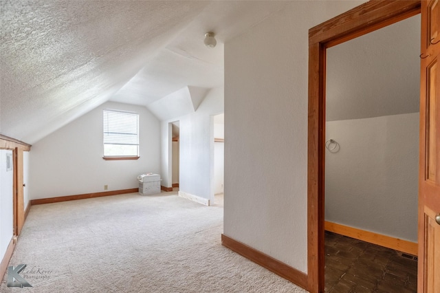 3017 County Road 154, Tuscola, TX 79562 - additional living space with lofted ceiling, baseboards, and carpet flooring