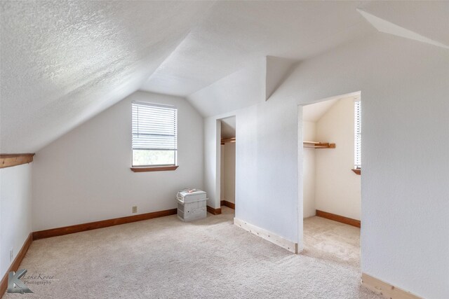 3017 County Road 154, Tuscola, TX 79562 - bonus room with lofted ceiling, carpet floors, and baseboards