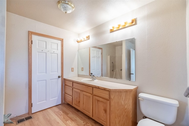 3017 County Road 154, Tuscola, TX 79562 - full bath featuring vanity, wood finished floors, and toilet