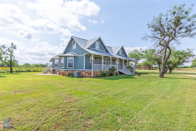 3017 County Road 154, Tuscola, TX 79562 - view of home's exterior with covered porch, a lawn, central air condition unit, stairs, and board and batten siding