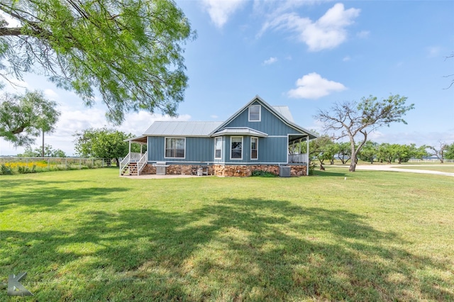3017 County Road 154, Tuscola, TX 79562 - view of front of property featuring a front yard, metal roof, and central AC