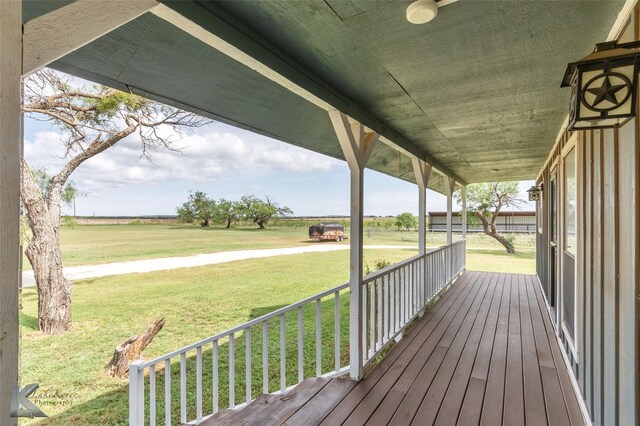 3017 County Road 154, Tuscola, TX 79562 - wooden porch with a lawn