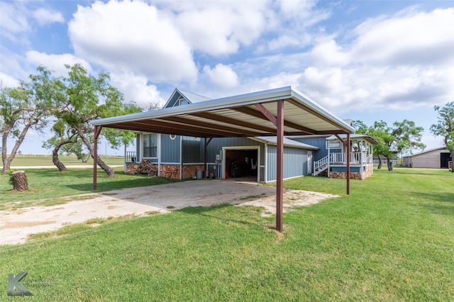 3017 County Road 154, Tuscola, TX 79562 - rear view of house featuring a garage, a yard, an outdoor structure, and stone siding