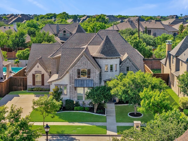 7363 Calla Lilly Ln, Frisco, TX 75034 - french country home featuring stone siding, roof with shingles, and a residential view
