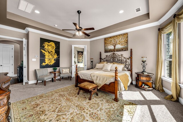 7363 Calla Lilly Ln, Frisco, TX 75034 - carpeted bedroom with a tray ceiling, arched walkways, baseboards, ornamental molding, and recessed lighting