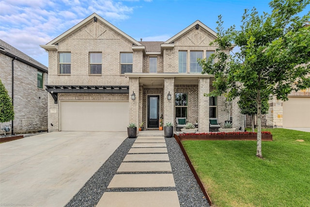752 Fletcher Dr, Fate, TX 75087 - view of front of home with brick siding, a front lawn, driveway, and a garage