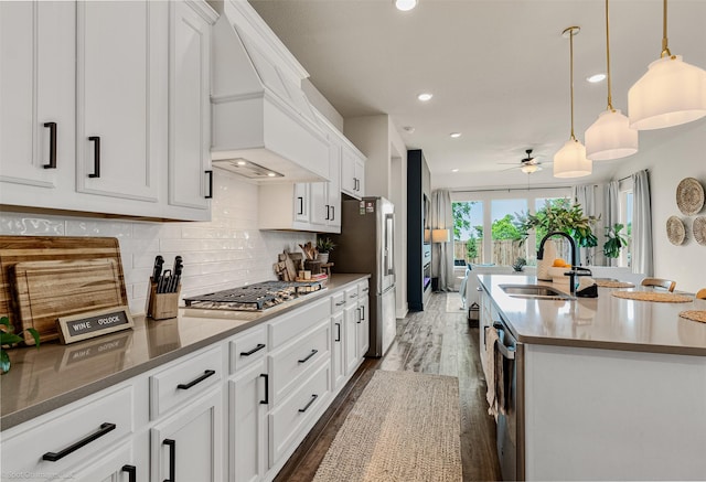 752 Fletcher Dr, Fate, TX 75087 - kitchen featuring a sink, stainless steel appliances, a ceiling fan, recessed lighting, and white cabinetry
