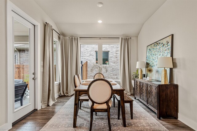752 Fletcher Dr, Fate, TX 75087 - dining room with vaulted ceiling, dark wood-style flooring, and baseboards