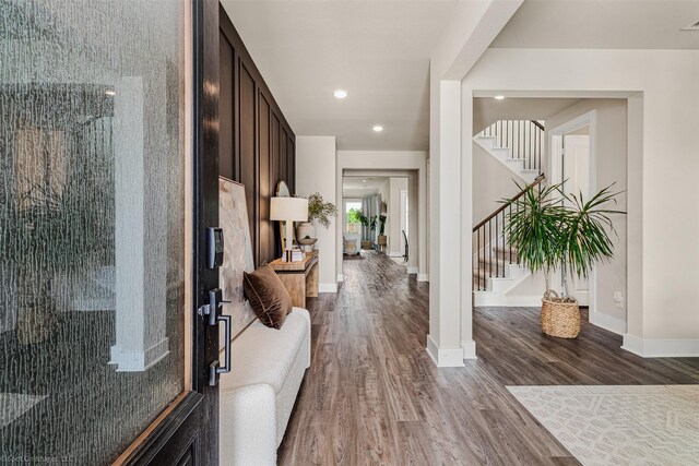 752 Fletcher Dr, Fate, TX 75087 - hallway featuring stairs, wood finished floors, baseboards, and recessed lighting
