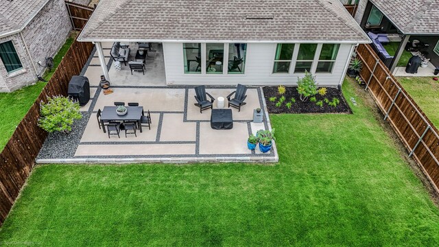 752 Fletcher Dr, Fate, TX 75087 - rear view of property with roof with shingles and a patio