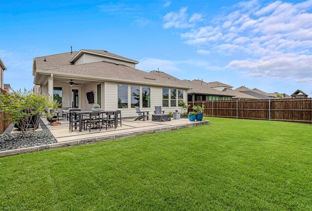 752 Fletcher Dr, Fate, TX 75087 - back of property with a patio, ceiling fan, and roof with shingles