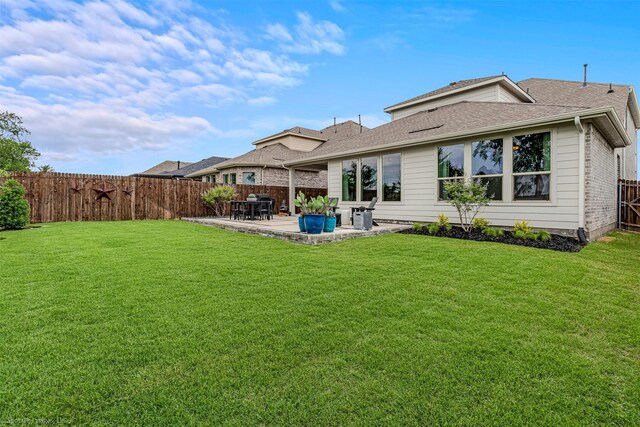752 Fletcher Dr, Fate, TX 75087 - rear view of house featuring a patio area and roof with shingles