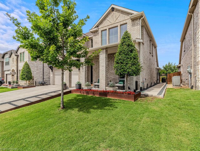 752 Fletcher Dr, Fate, TX 75087 - view of front of property with brick siding, concrete driveway, and a garage