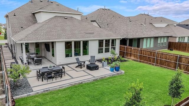 752 Fletcher Dr, Fate, TX 75087 - rear view of house with a shingled roof and a patio