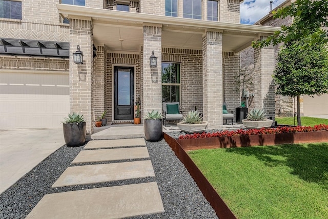 752 Fletcher Dr, Fate, TX 75087 - entrance to property featuring a porch, brick siding, driveway, and a yard