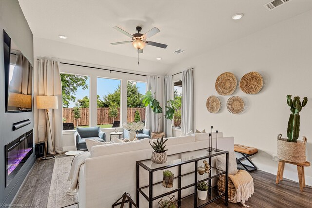 752 Fletcher Dr, Fate, TX 75087 - living room featuring healthy amount of natural light, wood finished floors, ceiling fan, baseboards, and recessed lighting