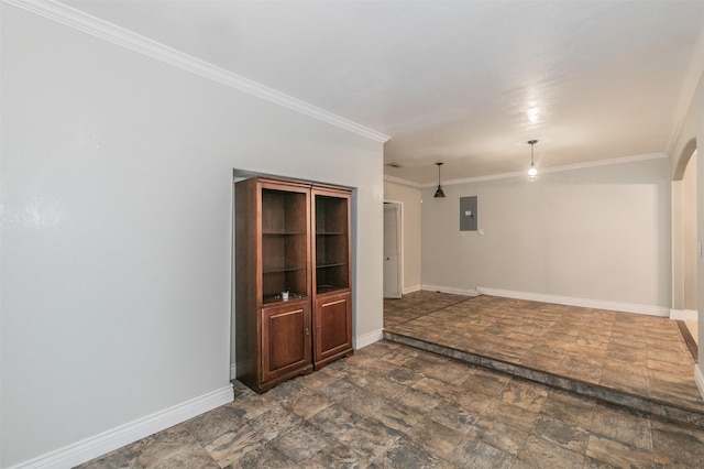 133 SE Newton Dr, Burleson, TX 76028 - spare room featuring electric panel, stone finish flooring, baseboards, and ornamental molding