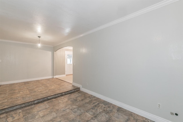 133 SE Newton Dr, Burleson, TX 76028 - spare room featuring arched walkways, crown molding, baseboards, and stone finish floors