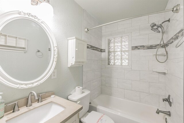 133 SE Newton Dr, Burleson, TX 76028 - full bathroom featuring vanity, bathtub / shower combination, toilet, and a textured wall