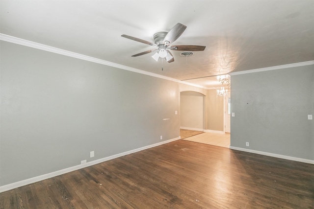 133 SE Newton Dr, Burleson, TX 76028 - spare room featuring arched walkways, ceiling fan, ornamental molding, baseboards, and wood finished floors