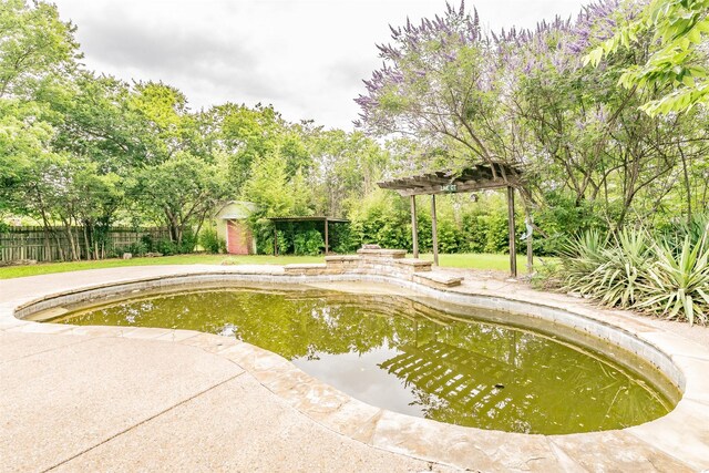 133 SE Newton Dr, Burleson, TX 76028 - view of swimming pool featuring a pergola and view of wooded area