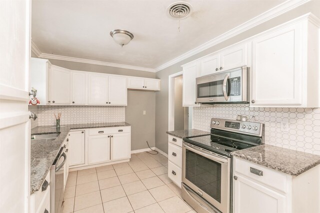 133 SE Newton Dr, Burleson, TX 76028 - kitchen with appliances with stainless steel finishes, a sink, decorative backsplash, light tile patterned flooring, and light stone counters