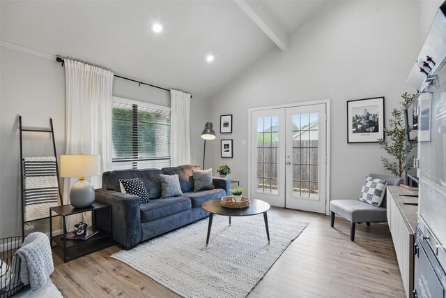 105 Yorkshire Ct, Euless, TX 76040 - living area with french doors, beamed ceiling, light wood-type flooring, plenty of natural light, and high vaulted ceiling