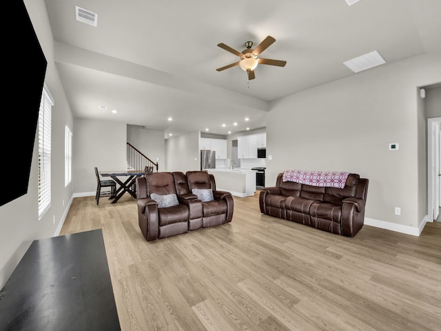 9100 Cacti Ct, Fort Worth, TX 76036 - living room with stairs, ceiling fan, light wood-style flooring, baseboards, and recessed lighting