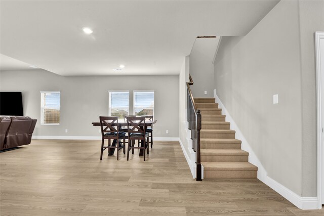 9100 Cacti Ct, Fort Worth, TX 76036 - dining space featuring stairway, light wood-style floors, baseboards, and recessed lighting