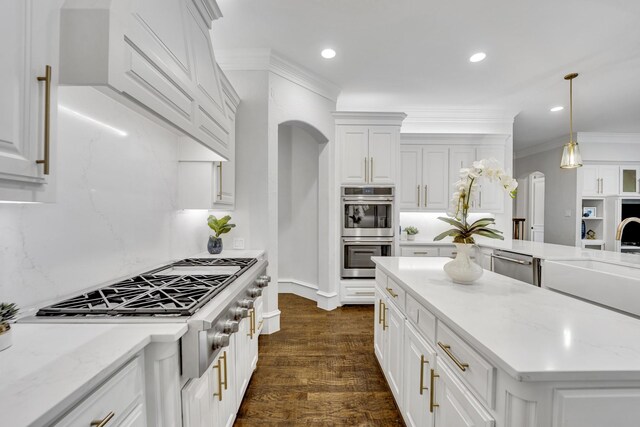 7209 Braemar Ter, Colleyville, TX 76034 - kitchen featuring appliances with stainless steel finishes, white cabinetry, crown molding, a sink, and recessed lighting