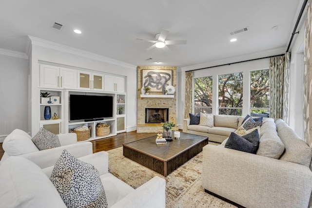 7209 Braemar Ter, Colleyville, TX 76034 - living area featuring ornamental molding, ceiling fan, wood finished floors, a fireplace, and baseboards