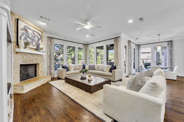 7209 Braemar Ter, Colleyville, TX 76034 - living room featuring ornamental molding, ceiling fan, dark wood finished floors, a fireplace, and recessed lighting