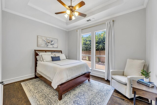 7209 Braemar Ter, Colleyville, TX 76034 - bedroom featuring a tray ceiling, wood finished floors, baseboards, ornamental molding, and a ceiling fan