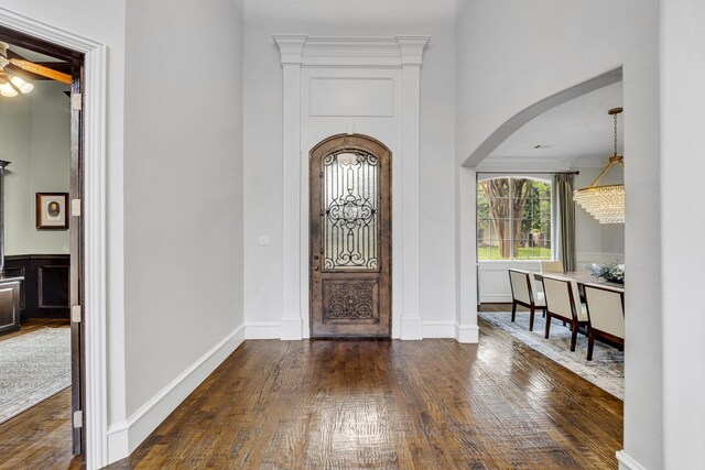 7209 Braemar Ter, Colleyville, TX 76034 - foyer entrance with arched walkways, hardwood / wood-style flooring, and a ceiling fan
