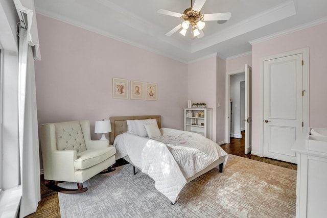 7209 Braemar Ter, Colleyville, TX 76034 - bedroom featuring a tray ceiling, crown molding, wood finished floors, and ceiling fan