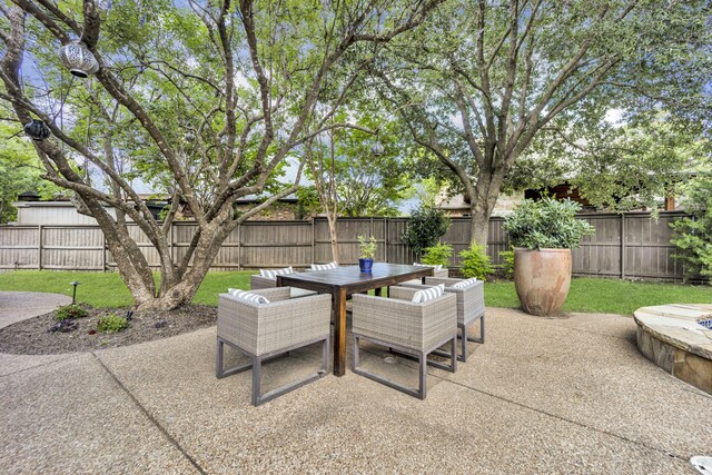 7209 Braemar Ter, Colleyville, TX 76034 - fenced backyard with a patio and outdoor dining area