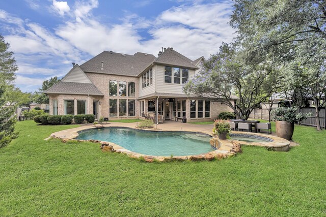 7209 Braemar Ter, Colleyville, TX 76034 - rear view of house with an in-ground hot tub, brick siding, a patio, and a shingled roof