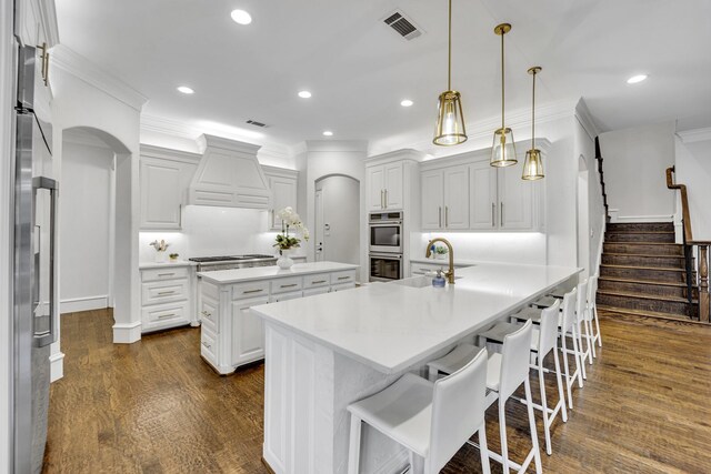 7209 Braemar Ter, Colleyville, TX 76034 - kitchen featuring stainless steel appliances, a sink, crown molding, a center island, and custom range hood