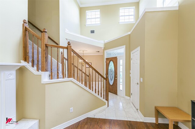 3635 Greenacres Place Dr Unit 350, Bossier City, LA 71111 - foyer featuring a high ceiling, baseboards, stairway, and ornamental molding