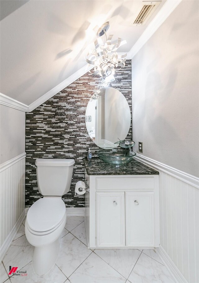 3635 Greenacres Place Dr Unit 350, Bossier City, LA 71111 - half bathroom with vanity, a wainscoted wall, marble look tile flooring, toilet, and lofted ceiling