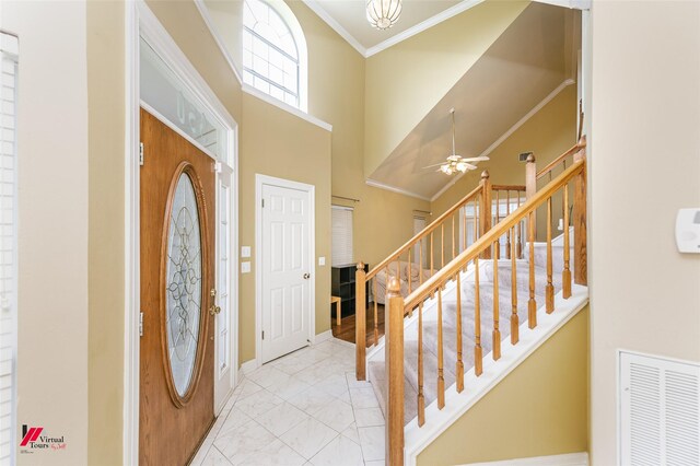 3635 Greenacres Place Dr Unit 350, Bossier City, LA 71111 - foyer entrance with stairs, marble look tile flooring, a high ceiling, ceiling fan, and ornamental molding