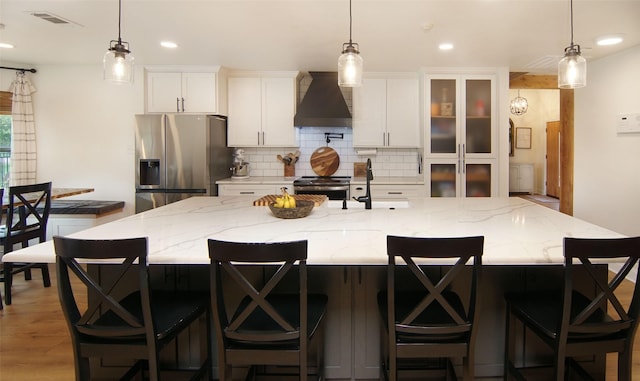 13417 Hickory Creek Dr, Haslet, TX 76052 - kitchen featuring stainless steel appliances, custom range hood, backsplash, white cabinetry, and recessed lighting