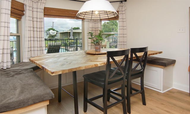 13417 Hickory Creek Dr, Haslet, TX 76052 - dining room featuring breakfast area, wood finished floors, healthy amount of natural light, and baseboards