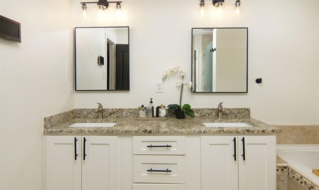 13417 Hickory Creek Dr, Haslet, TX 76052 - full bathroom with double vanity and a garden tub